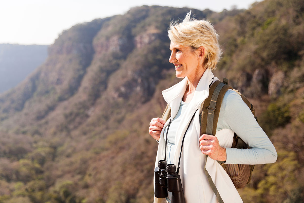 women hiking and smiling without fear bowel incontinence